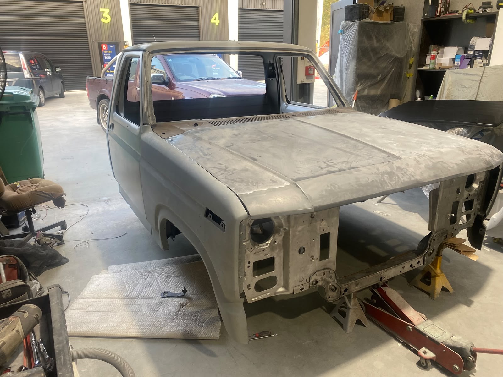Classic pickup body in primer during panel preparation