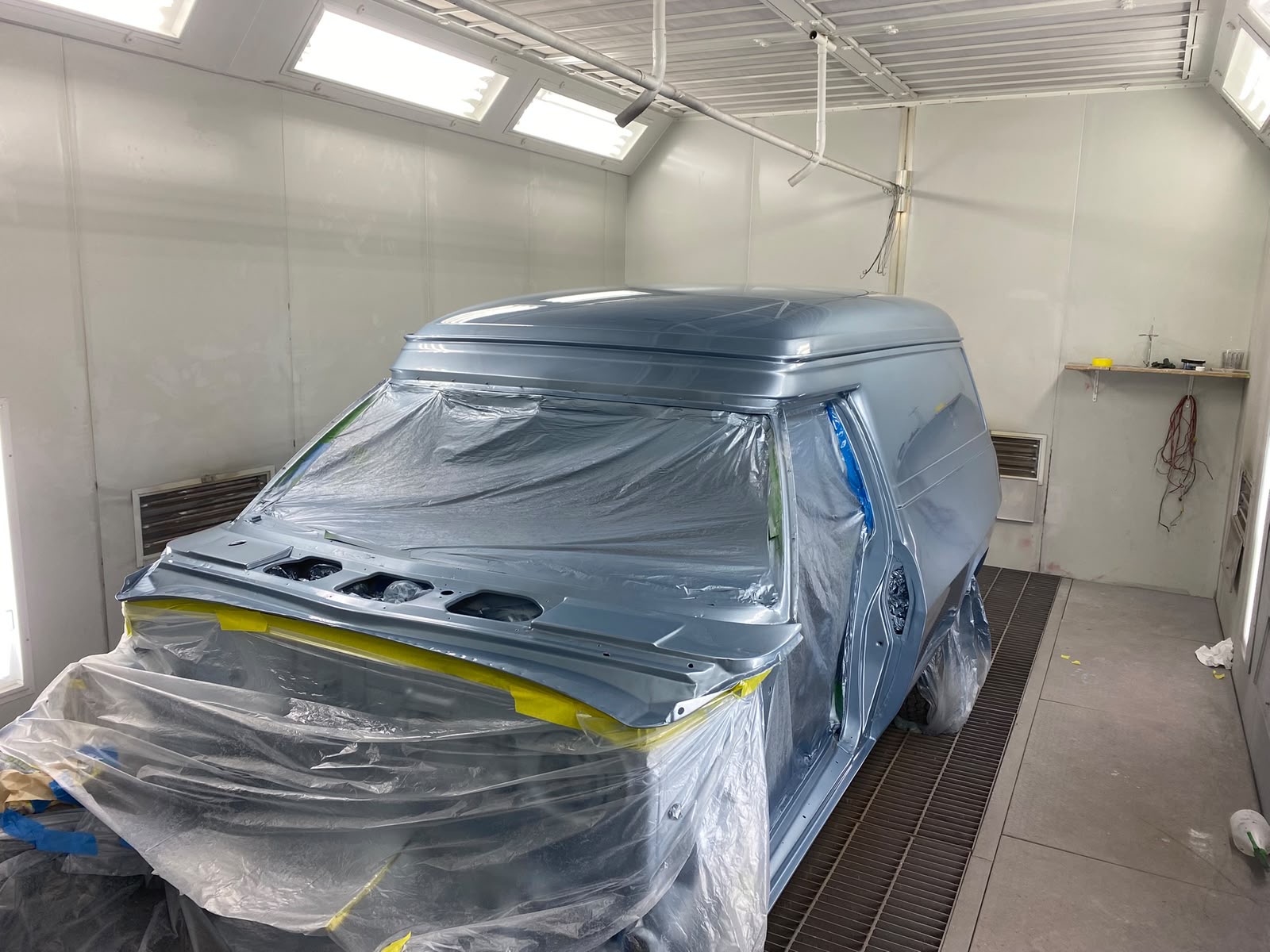 Van masked up and freshly sprayed inside spray booth