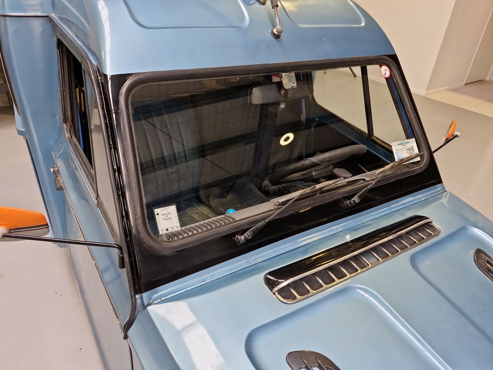 Classic car windscreen and trim refitted after refinishing